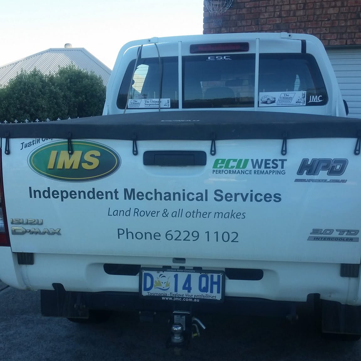 The signwritten tailgate of the Independent Mechanical Services work ute
